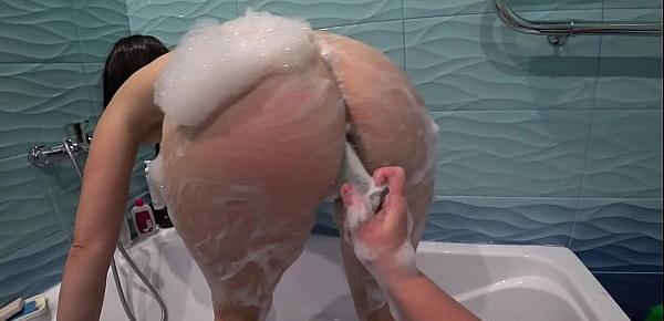  Lesbian spies on a girlfriend in the shower, then washes her big ass and hairy pussy and fucks in anal until orgasm. POV.